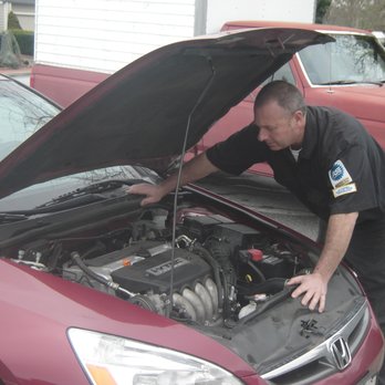 Paul working on a car